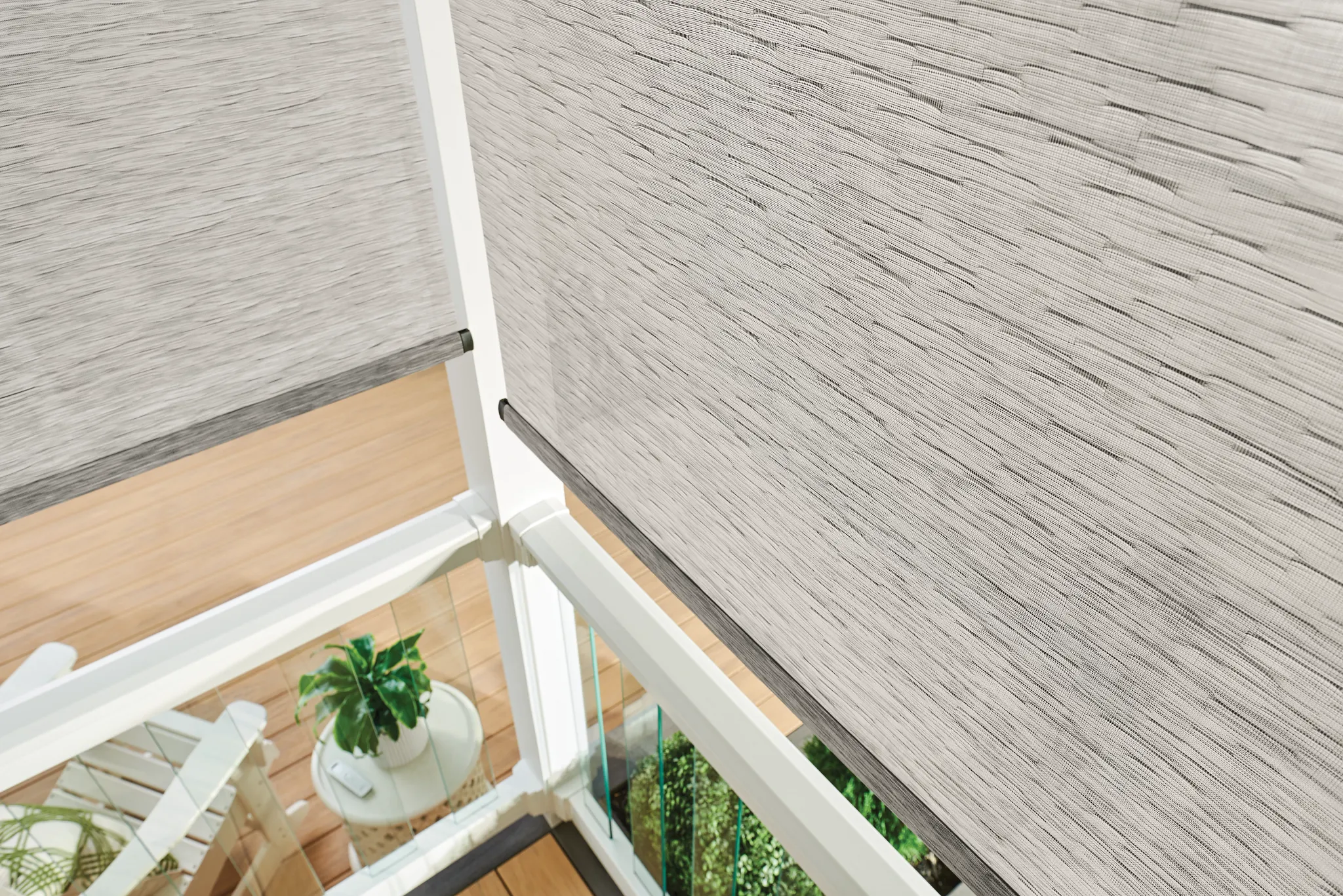 Graber outdoor solar shades beside a porch seating area