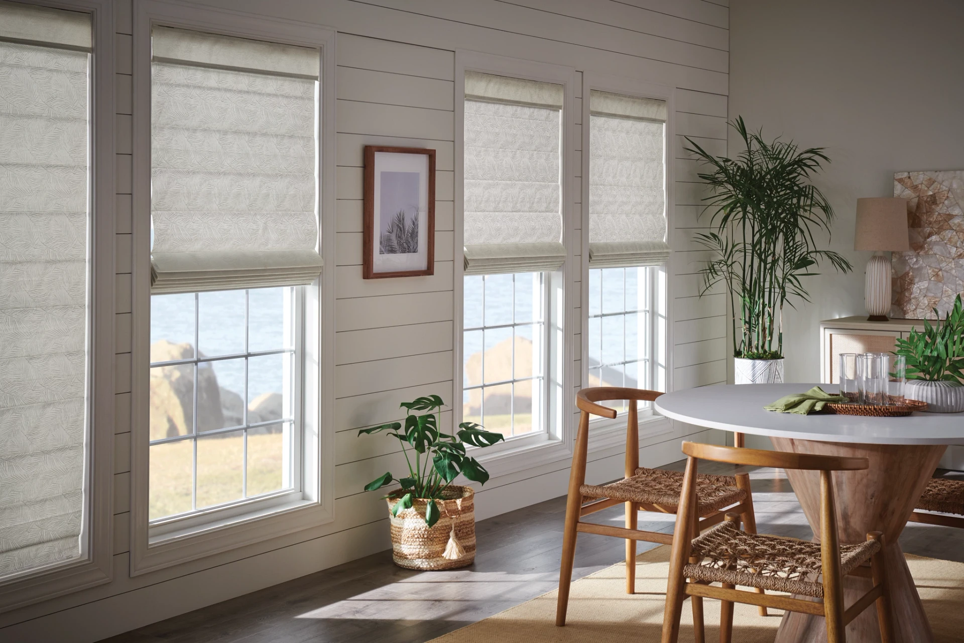 Light-coloured Graber Classic Roman shades in an interior.