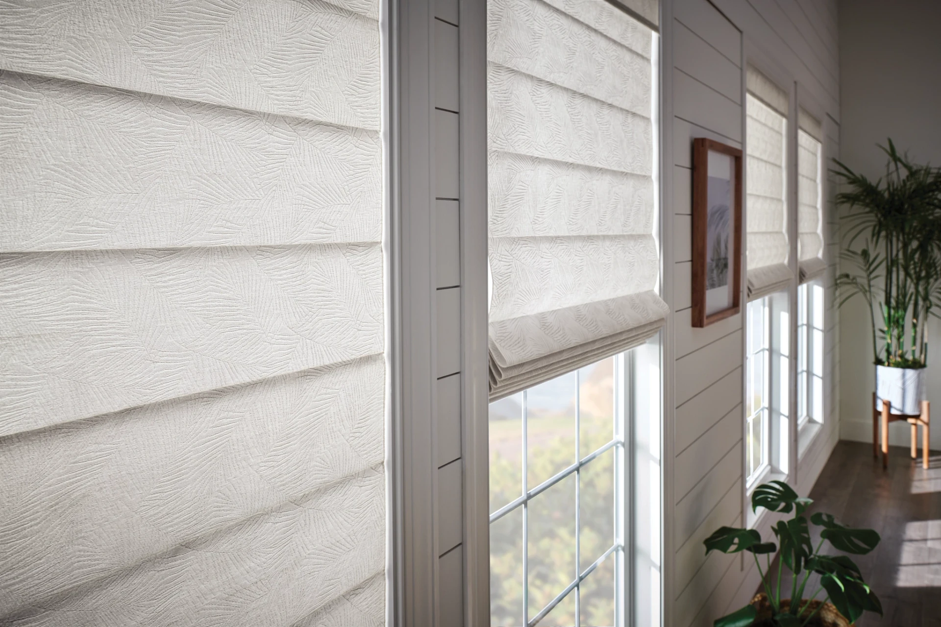 A second room view of Graber Classic Roman shades.