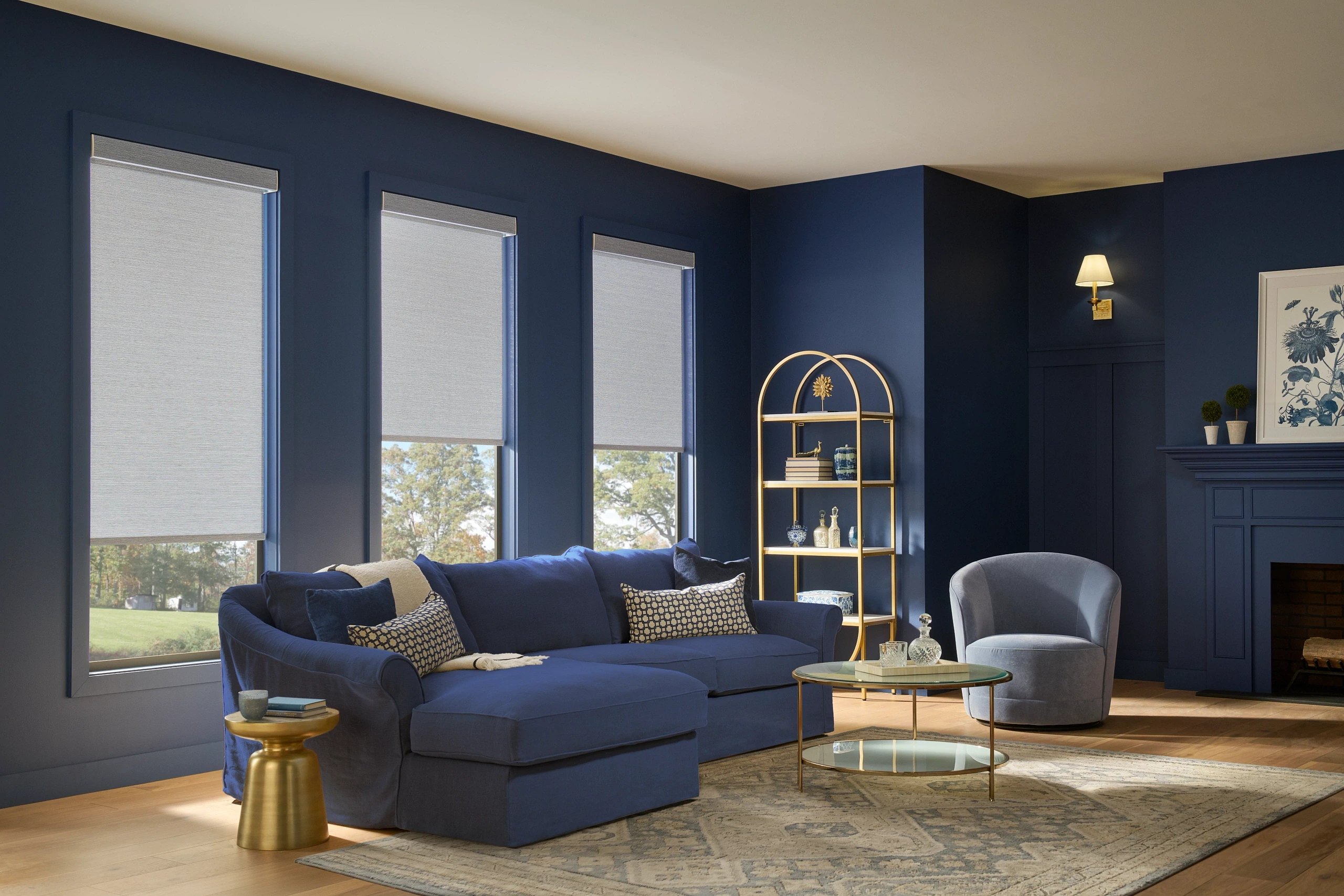 Custom Graber textured roller shades professionally installed in a luxury navy blue living room.