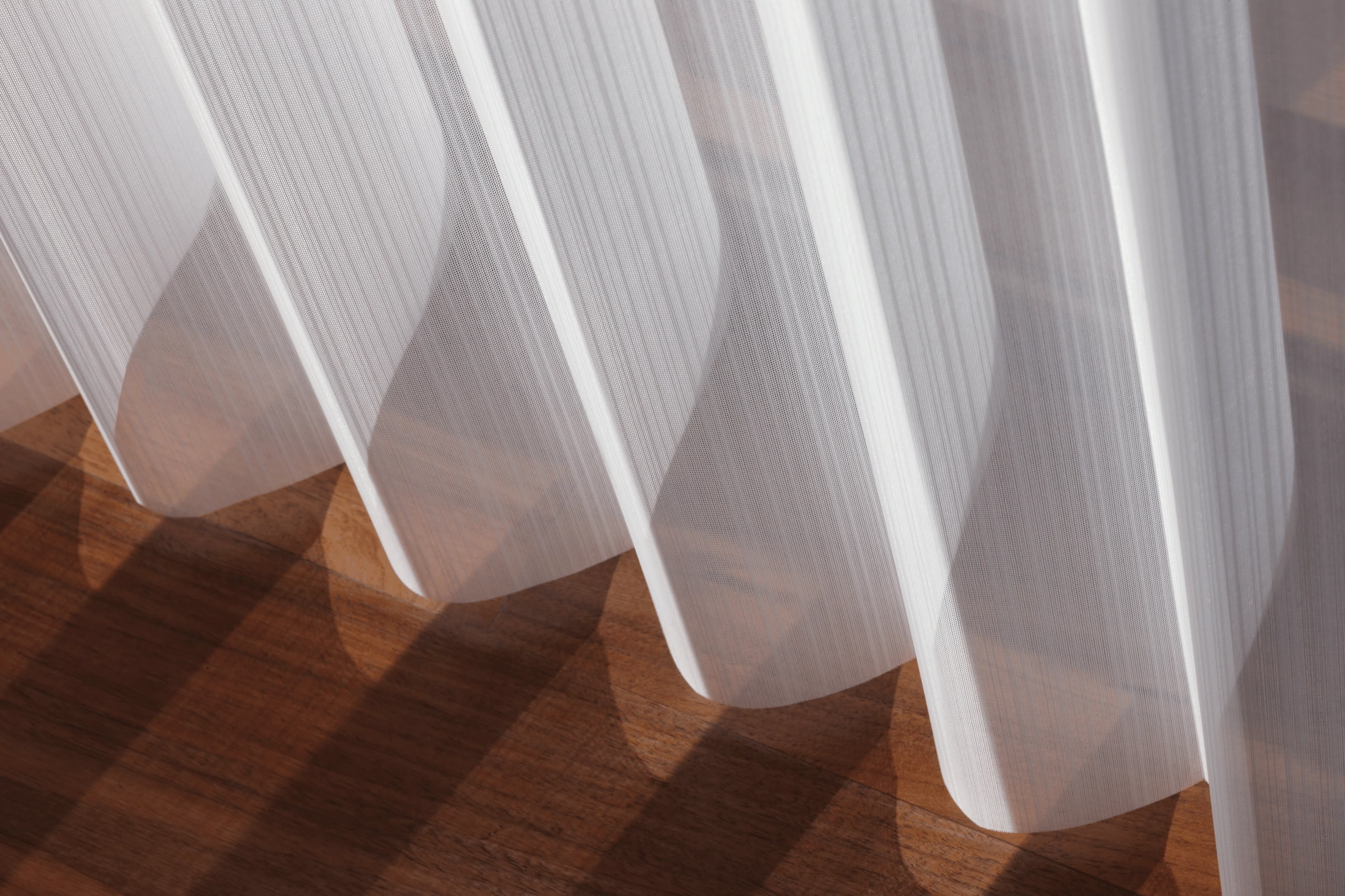 Hunter Douglas Luminette® Privacy Sheers at the window.